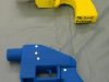 Seized plastic handguns which were created using 3D printing technology are displayed at Kanagawa police station in Yokohama, south of Tokyo, in this photo taken by Kyodo May 8, 2014. Yoshimoto Imura became the first man to be arrested in Japan for illegal possession of two guns he created himself using 3D printing technology, Japanese media said on Thursday. The 27-year-old, a college employee in the city of Kawasaki, was arrested after police found video online posted by Imura claiming to have produced his own guns. Gun possession is strictly regulated in Japan. Police raided Imura's home and found five guns, two of which could fire real bullets, Japanese media said. Mandatory credit REUTERS/Kyodo (JAPAN - Tags: CRIME LAW SCIENCE TECHNOLOGY) ATTENTION EDITORS - THIS IMAGE HAS BEEN SUPPLIED BY A THIRD PARTY. FOR EDITORIAL USE ONLY. NOT FOR SALE FOR MARKETING OR ADVERTISING CAMPAIGNS. MANDATORY CREDIT. JAPAN OUT. NO COMMERCIAL OR EDITORIAL SALES IN JAPAN. THIS PICTURE IS DISTRIBUTED EXACTLY AS RECEIVED BY REUTERS, AS A SERVICE TO CLIENTS