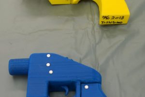Seized plastic handguns which were created using 3D printing technology are displayed at Kanagawa police station in Yokohama, south of Tokyo, in this photo taken by Kyodo May 8, 2014. Yoshimoto Imura became the first man to be arrested in Japan for illegal possession of two guns he created himself using 3D printing technology, Japanese media said on Thursday. The 27-year-old, a college employee in the city of Kawasaki, was arrested after police found video online posted by Imura claiming to have produced his own guns. Gun possession is strictly regulated in Japan. Police raided Imura's home and found five guns, two of which could fire real bullets, Japanese media said. Mandatory credit REUTERS/Kyodo (JAPAN - Tags: CRIME LAW SCIENCE TECHNOLOGY) ATTENTION EDITORS - THIS IMAGE HAS BEEN SUPPLIED BY A THIRD PARTY. FOR EDITORIAL USE ONLY. NOT FOR SALE FOR MARKETING OR ADVERTISING CAMPAIGNS. MANDATORY CREDIT. JAPAN OUT. NO COMMERCIAL OR EDITORIAL SALES IN JAPAN. THIS PICTURE IS DISTRIBUTED EXACTLY AS RECEIVED BY REUTERS, AS A SERVICE TO CLIENTS
