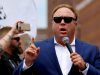 FILE PHOTO: Alex Jones from Infowars.com speaks during a rally in support of Republican presidential candidate Donald Trump near the Republican National Convention in Cleveland, Ohio, U.S., July 18, 2016. REUTERS/Lucas Jackson/File Photo