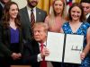 U.S. President Donald Trump shows an executive order linking "free speech" efforts at public universities to federal grants during a signing ceremony in the East Room at the White House in Washington, U.S., March 21, 2019. REUTERS/Joshua Roberts