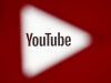 A 3D-printed YouTube icon is seen in front of a displayed YouTube logo in this illustration taken October 25, 2017. REUTERS/Dado Ruvic/Ilustration