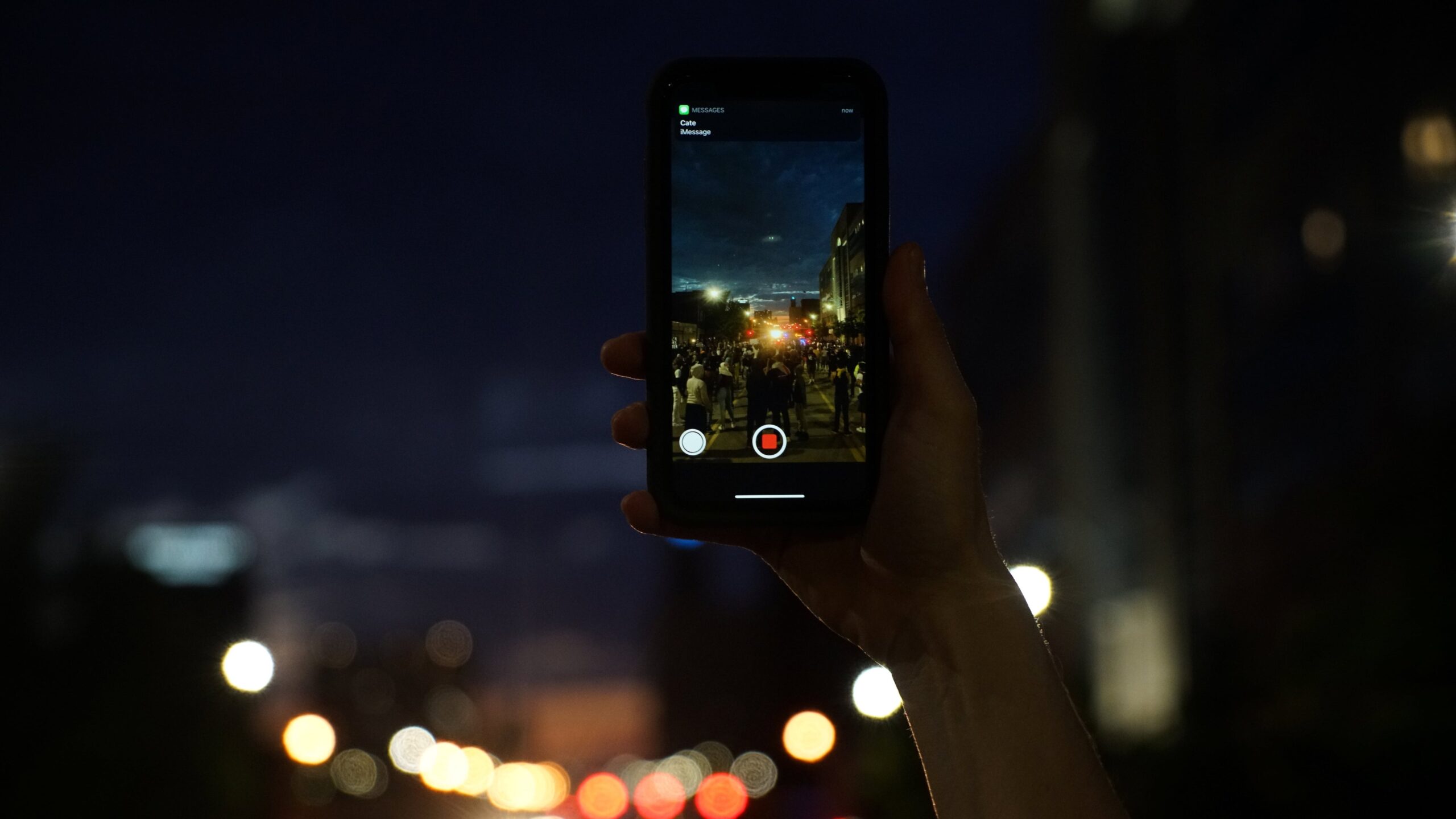 A protester photographs a protest with his cellphone in St. Louis, Missouri, following the death in Minneapolis of George Floyd.