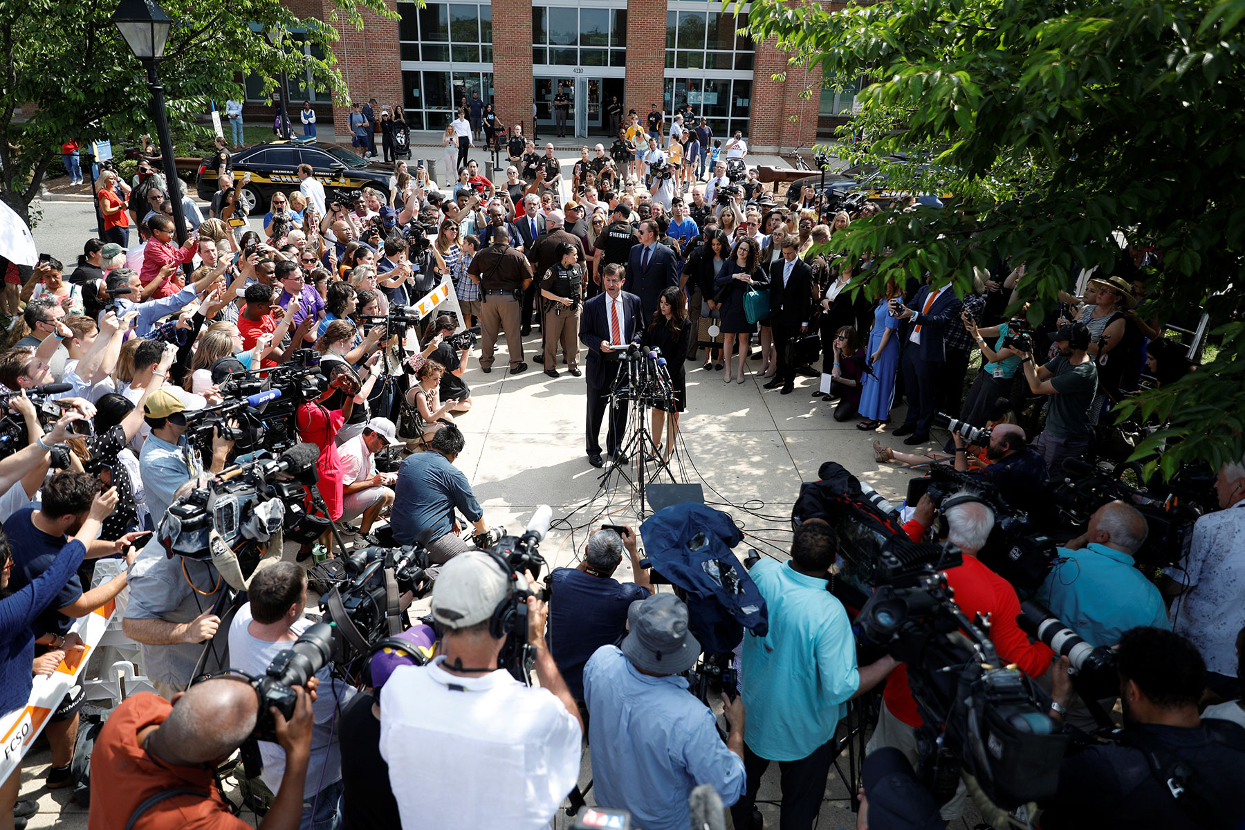 Johnny Depp's attorneys Benjamin Chew and Camille Vasquez speak to the media after the jury announced split verdicts in favor of both Johnny Depp and his ex-wife Amber Heard on their claim and counter-claim in the Depp v. Heard civil defamation trial at the Fairfax County Circuit Courthouse in Fairfax, Virginia, June 1, 2022. (REUTERS/Tom Brenner)