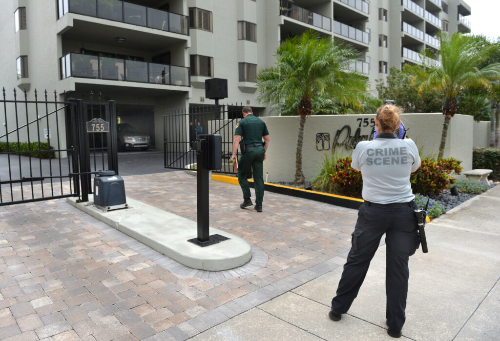 Officials of the Sarasota County Sheriff's department outside the condominium where a 58-year-old man was fatally shot after allegedly arming himself with a knife and coming at deputies.