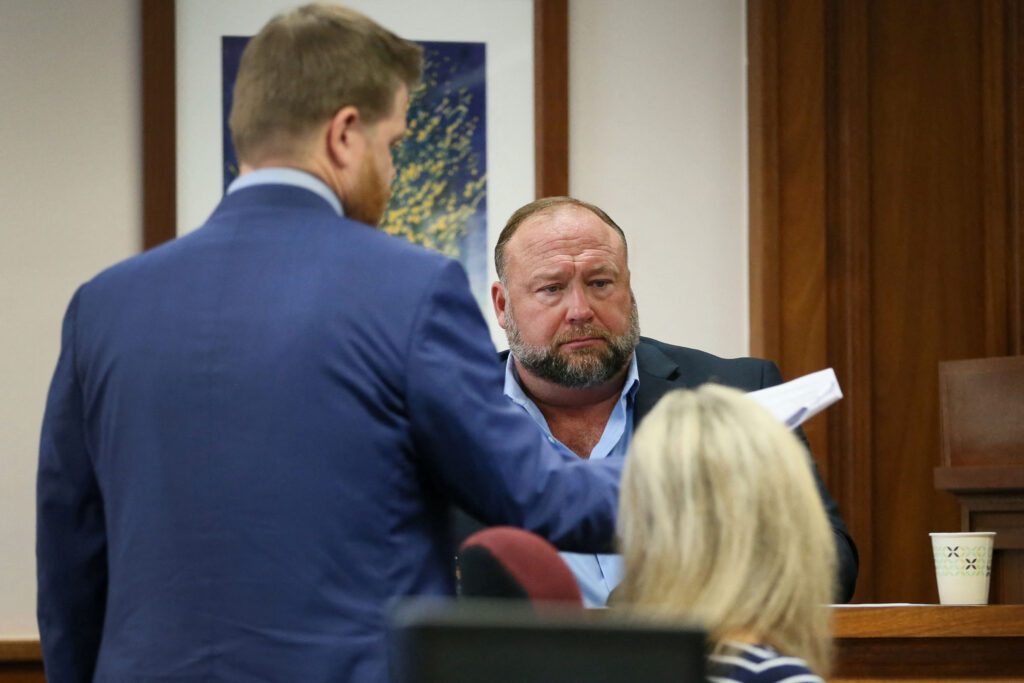 Attorney Mark Bankston questions Alex Jones on the stand during his trial.