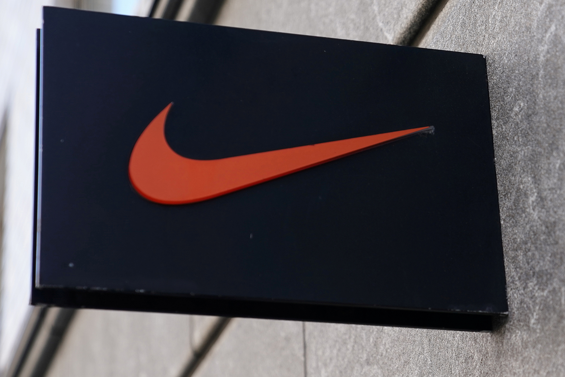 The Nike swoosh logo is pictured on a store in New York City