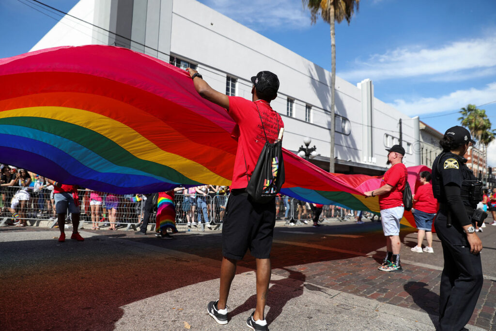 Revelers participate in the pride parade in Tampa