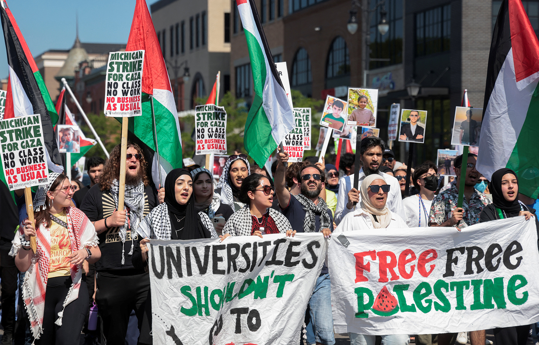 A coalition of pro-Palestinian University of Michigan students and supporters protest in the street