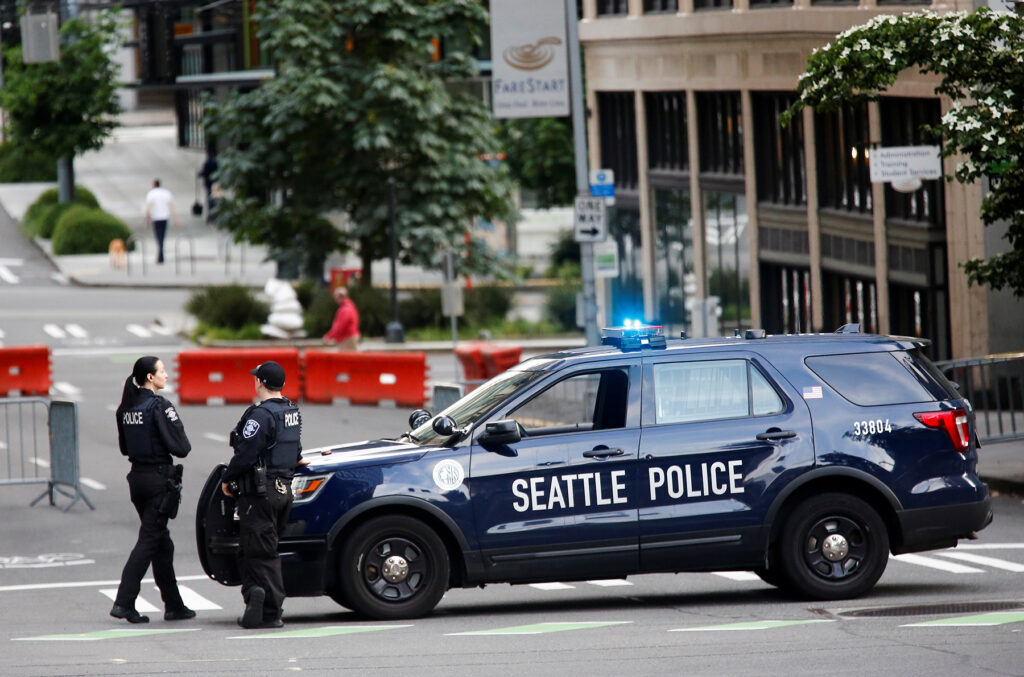 Officers at the Seattle Police Department's West Precinct in Seattle