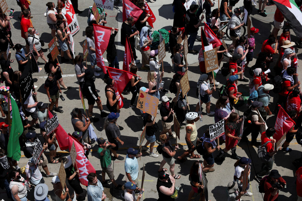 Demonstrators and members of the The Coalition to March on the RNC hold a rally, on the first day of the Republican National Convention, in Milwaukee