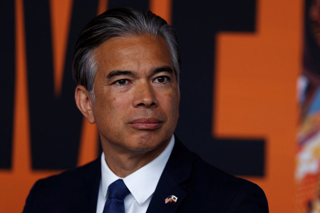 California Attorney General Rob Bonta sits, during a press conference announcing a lawsuit against oil giant Exxon Mobil over its alleged role in global plastic waste pollution at Climate Week in New York City