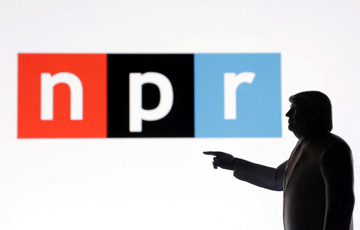 Illustration shows 3D-printed miniature model of U.S. President Donald Trump and NPR logo