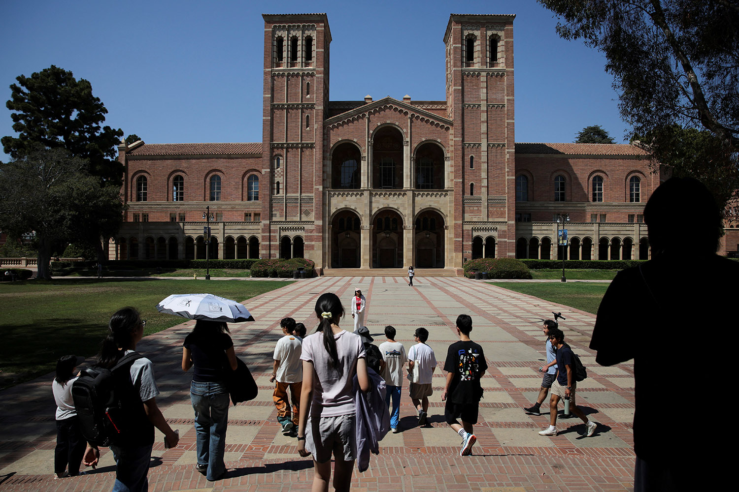 People walk through the campus of the University of California Los Angeles (UCLA) in Los Angeles