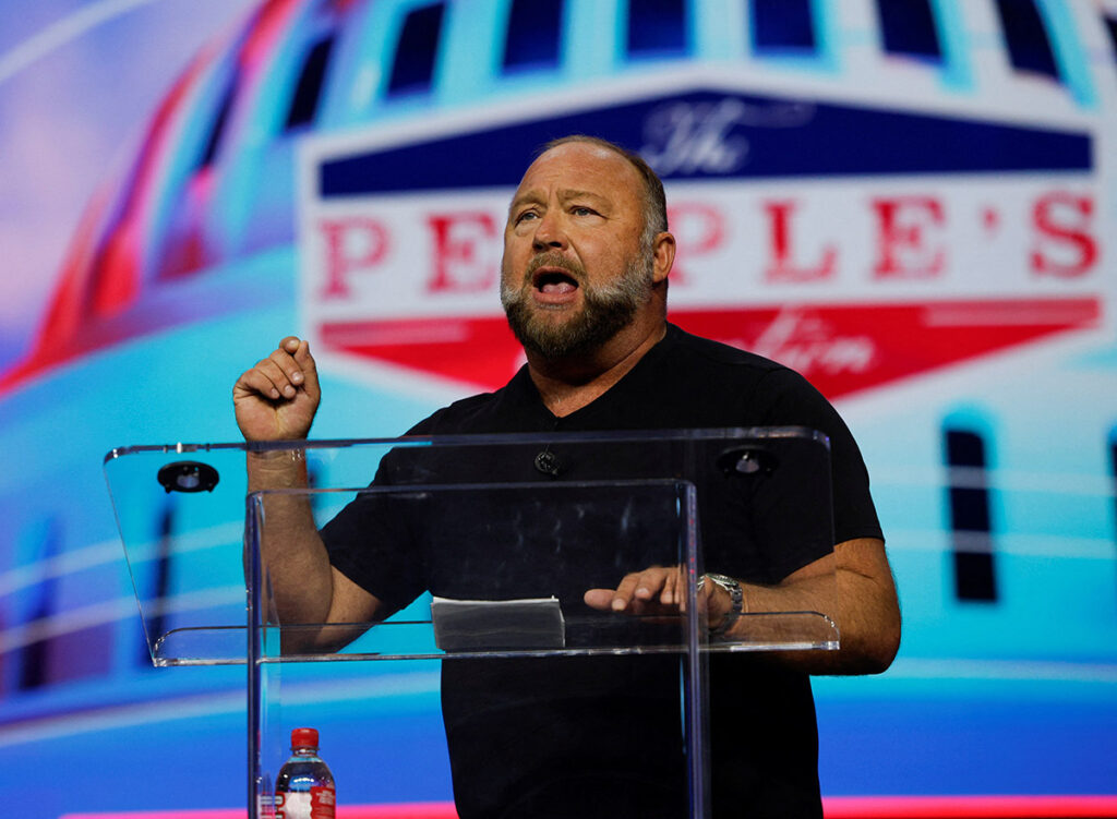 Far-right radio host Alex Jones speaks at an event held by the national conservative political movement, 'Turning Point' in Detroit