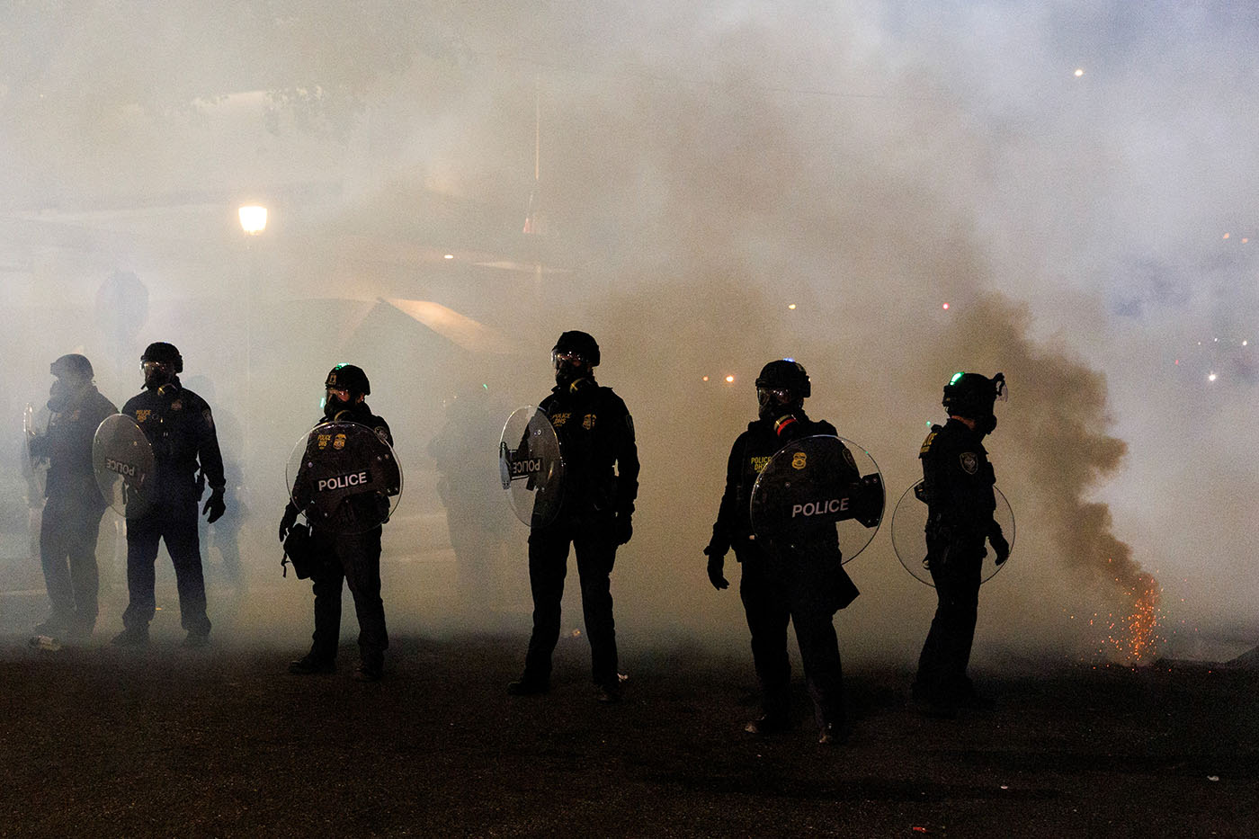 People protest against the Trump administration's immigration policies in Portland