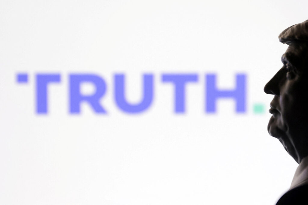 Illustration shows 3D printed miniature of U.S. president Donald Trump and Truth social logo